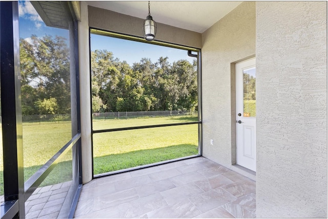 15420 27th Ct E, Parrish, FL 34219 - unfurnished sunroom featuring view of scattered trees
