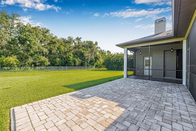 15420 27th Ct E, Parrish, FL 34219 - fenced backyard with a patio area and view of wooded area