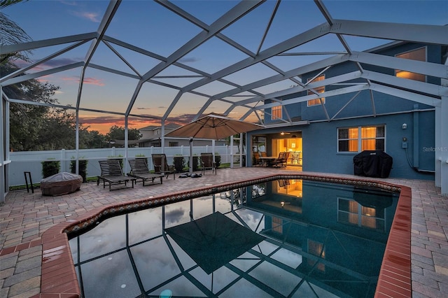 12424 White Bluff Rd, Hudson, FL 34669 - view of pool with a fire pit, a patio, grilling area, and glass enclosure