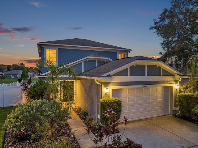 12424 White Bluff Rd, Hudson, FL 34669 - view of front of property featuring stucco siding, a garage, and driveway