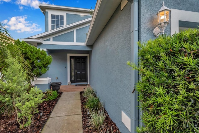 12424 White Bluff Rd, Hudson, FL 34669 - doorway to property with stucco siding