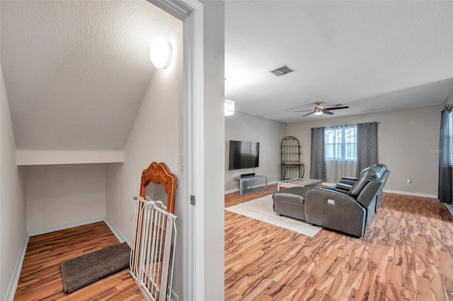 12424 White Bluff Rd, Hudson, FL 34669 - living area with light wood-style flooring and a ceiling fan