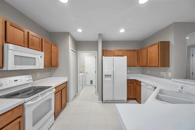 12424 White Bluff Rd, Hudson, FL 34669 - kitchen with white appliances, light countertops, recessed lighting, and brown cabinetry
