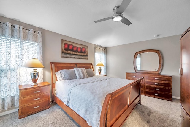 12424 White Bluff Rd, Hudson, FL 34669 - bedroom featuring light carpet and a ceiling fan