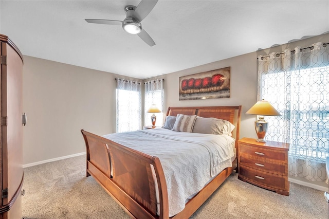 12424 White Bluff Rd, Hudson, FL 34669 - bedroom with light carpet and a ceiling fan