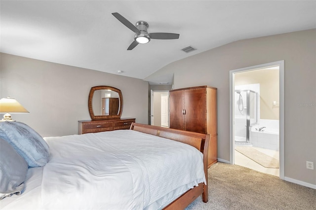 12424 White Bluff Rd, Hudson, FL 34669 - bedroom with vaulted ceiling, carpet floors, ensuite bathroom, and a ceiling fan