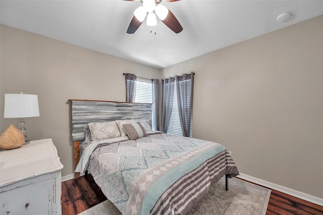 12424 White Bluff Rd, Hudson, FL 34669 - bedroom with dark wood finished floors and ceiling fan