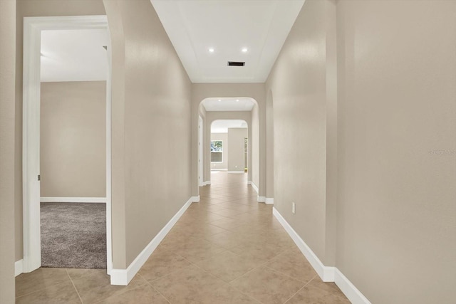 2120 Gwynhurst Blvd, Wesley Chapel, FL 33543 - hallway featuring arched walkways, light tile patterned floors, and recessed lighting