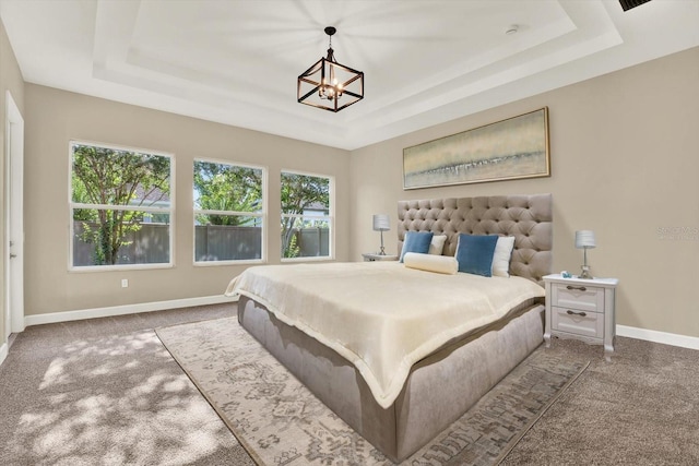 2120 Gwynhurst Blvd, Wesley Chapel, FL 33543 - bedroom featuring a raised ceiling, carpet, and a chandelier
