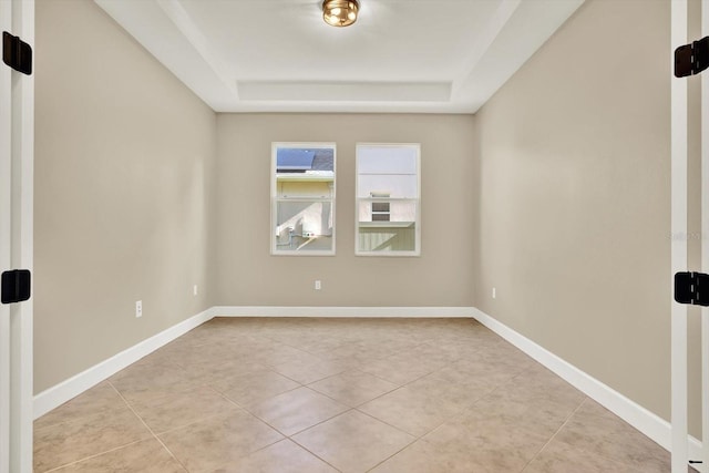 2120 Gwynhurst Blvd, Wesley Chapel, FL 33543 - empty room featuring a raised ceiling and light tile patterned flooring