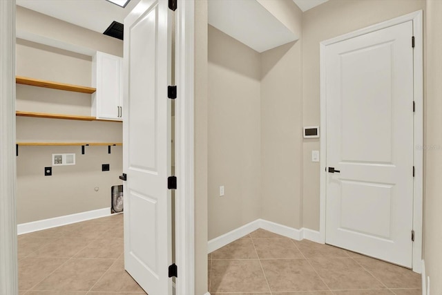 2120 Gwynhurst Blvd, Wesley Chapel, FL 33543 - washroom with hookup for a washing machine, light tile patterned floors, cabinet space, and hookup for an electric dryer