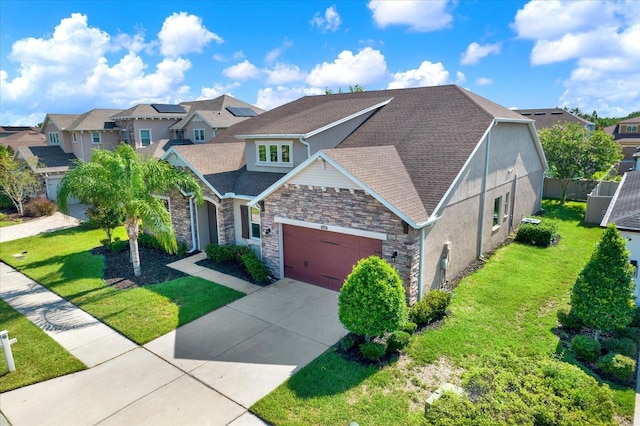 2120 Gwynhurst Blvd, Wesley Chapel, FL 33543 - view of front of house featuring a residential view, an attached garage, stone siding, and a front yard