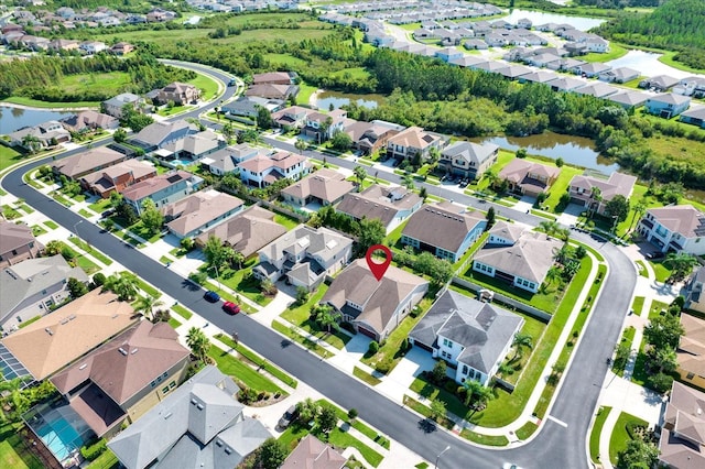 2120 Gwynhurst Blvd, Wesley Chapel, FL 33543 - aerial view of property and surrounding area with a large body of water and nearby suburban area