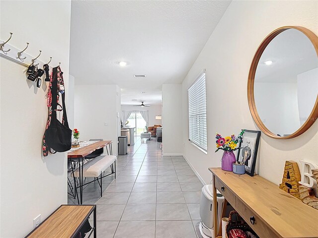 34033 Jasper Stone Dr, Wesley Chapel, FL 33543 - hall with light tile patterned floors and baseboards