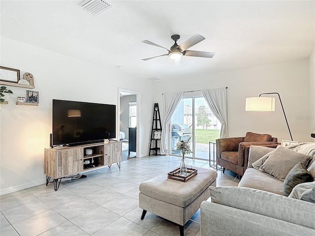34033 Jasper Stone Dr, Wesley Chapel, FL 33543 - living room featuring a ceiling fan and light tile patterned floors