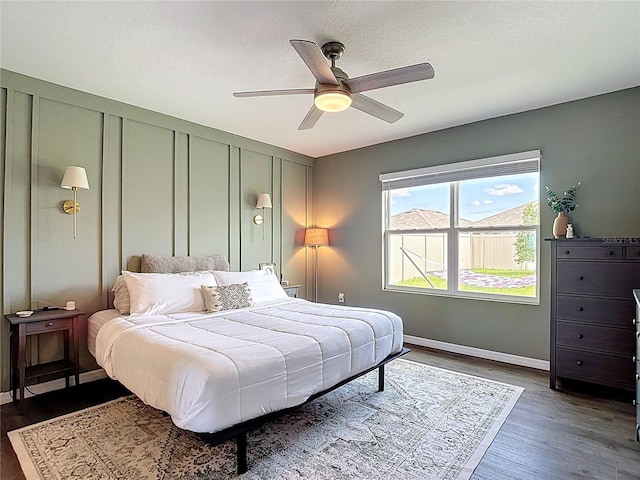 34033 Jasper Stone Dr, Wesley Chapel, FL 33543 - bedroom with dark wood-type flooring and a ceiling fan
