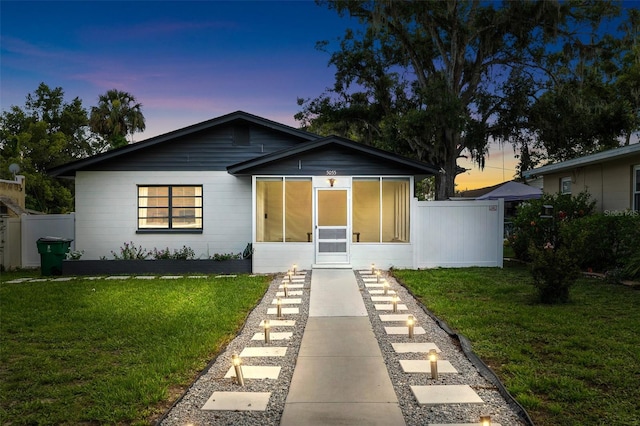 5055 9th St, Zephyrhills, FL 33542 - view of front facade featuring a sunroom