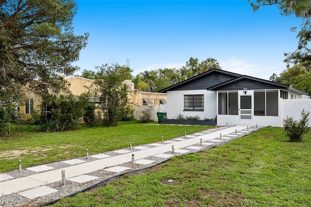 5055 9th St, Zephyrhills, FL 33542 - view of front facade featuring a sunroom