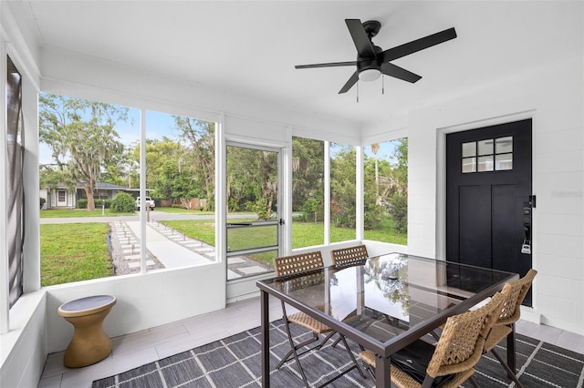 5055 9th St, Zephyrhills, FL 33542 - sunroom / solarium with a ceiling fan and outdoor dining area