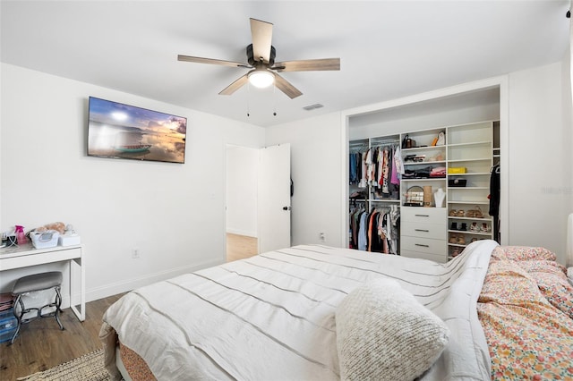 5055 9th St, Zephyrhills, FL 33542 - bedroom with wood finished floors, a closet, and ceiling fan