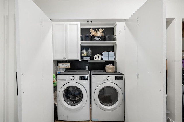 5055 9th St, Zephyrhills, FL 33542 - washroom featuring washer and clothes dryer and cabinet space