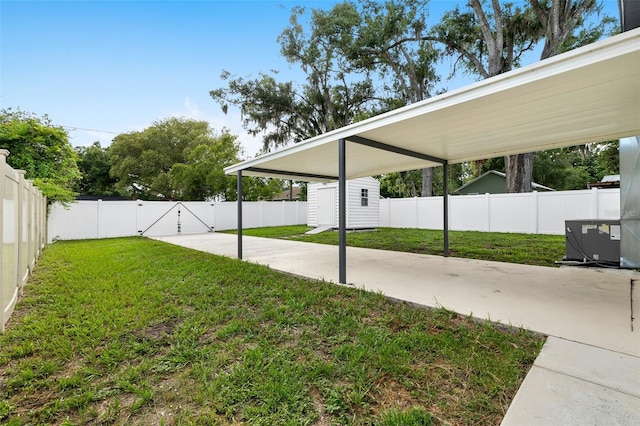 5055 9th St, Zephyrhills, FL 33542 - fenced backyard featuring a patio, a storage shed, and a gate