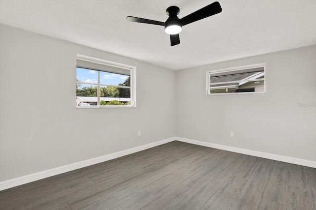 7835 Wallaba Ln, New Port Richey, FL 34653 - empty room with wood finished floors and a ceiling fan