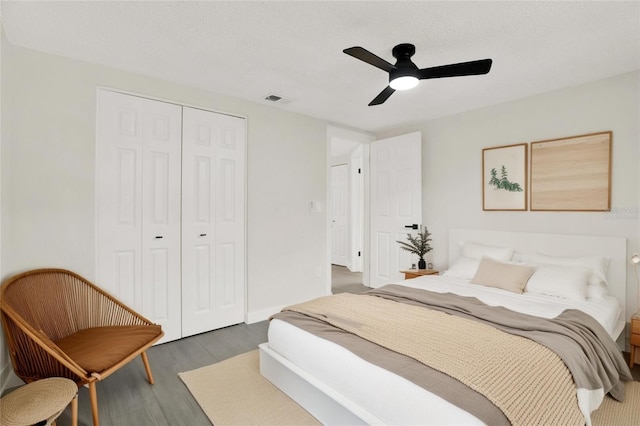 7835 Wallaba Ln, New Port Richey, FL 34653 - bedroom featuring wood finished floors, a closet, and a ceiling fan