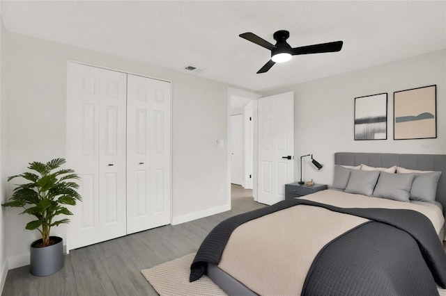 7835 Wallaba Ln, New Port Richey, FL 34653 - bedroom with wood finished floors, ceiling fan, and a closet