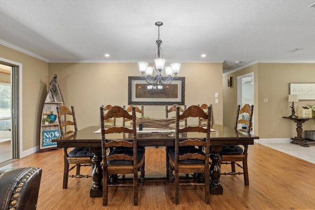 10584 N Dawnflower Pt, Crystal River, FL 34428 - dining space featuring a chandelier, light wood-style flooring, recessed lighting, and crown molding