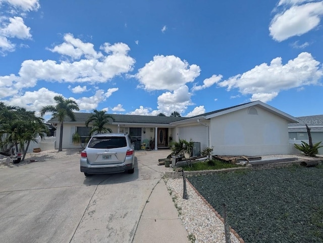 1008 Sago Palm Way, Apollo Beach, FL 33572 - ranch-style home with concrete driveway, an attached garage, and stucco siding