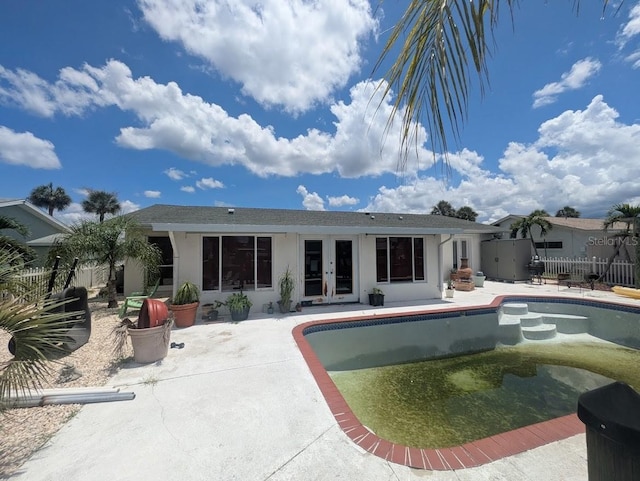 1008 Sago Palm Way, Apollo Beach, FL 33572 - back of house featuring french doors, stucco siding, and a patio area