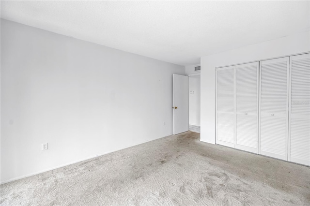 500 N Osceola Ave Unit 211, Clearwater, FL 33755 - unfurnished bedroom with carpet floors and a closet