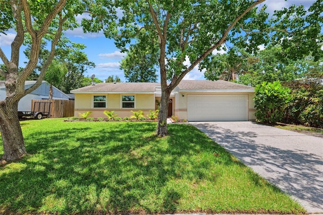 602 Timber Bay Cir W, Oldsmar, FL 34677 - ranch-style home with stucco siding, a garage, and driveway