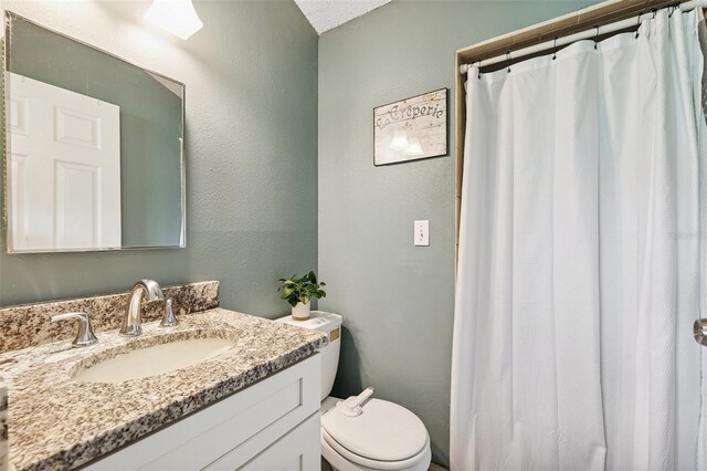 602 Timber Bay Cir W, Oldsmar, FL 34677 - bathroom with vanity, a textured wall, and a shower with shower curtain