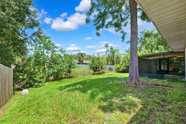 602 Timber Bay Cir W, Oldsmar, FL 34677 - fenced backyard featuring a sunroom