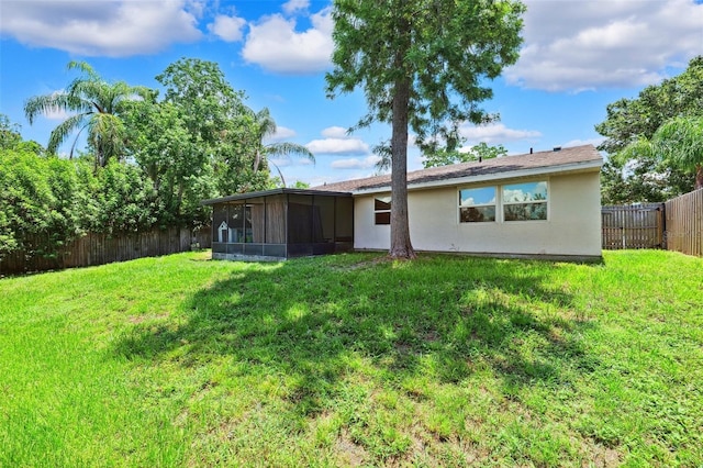 602 Timber Bay Cir W, Oldsmar, FL 34677 - back of house featuring a sunroom, a fenced backyard, and stucco siding