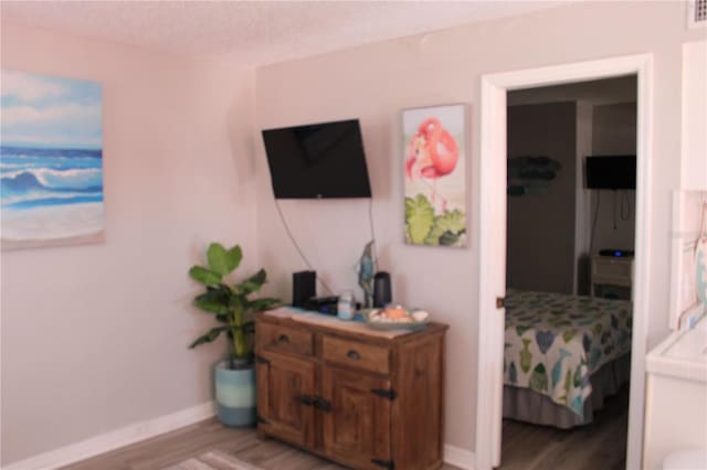 6800 Sunset Way Unit 1708, St Pete Beach, FL 33706 - living area featuring light wood-style flooring and baseboards