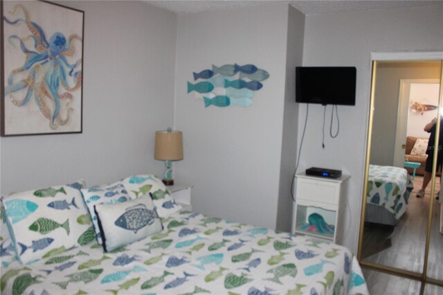 6800 Sunset Way Unit 1708, St Pete Beach, FL 33706 - bedroom featuring wood finished floors