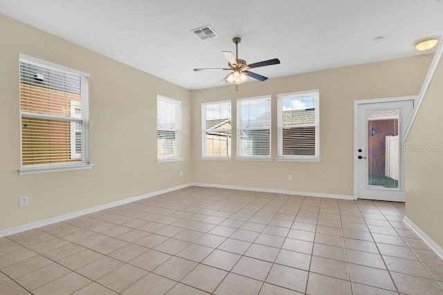 12975 Calderdale Ave, Windermere, FL 34786 - empty room with a ceiling fan and light tile patterned flooring