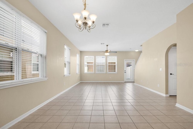 12975 Calderdale Ave, Windermere, FL 34786 - unfurnished room featuring arched walkways, a chandelier, ceiling fan, and light tile patterned flooring