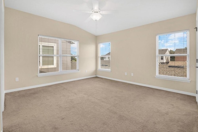 12975 Calderdale Ave, Windermere, FL 34786 - empty room with carpet, healthy amount of natural light, a ceiling fan, and vaulted ceiling