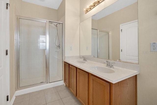 12975 Calderdale Ave, Windermere, FL 34786 - bathroom featuring double vanity, a shower stall, and tile patterned floors