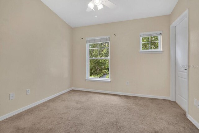 12975 Calderdale Ave, Windermere, FL 34786 - carpeted empty room with ceiling fan and plenty of natural light