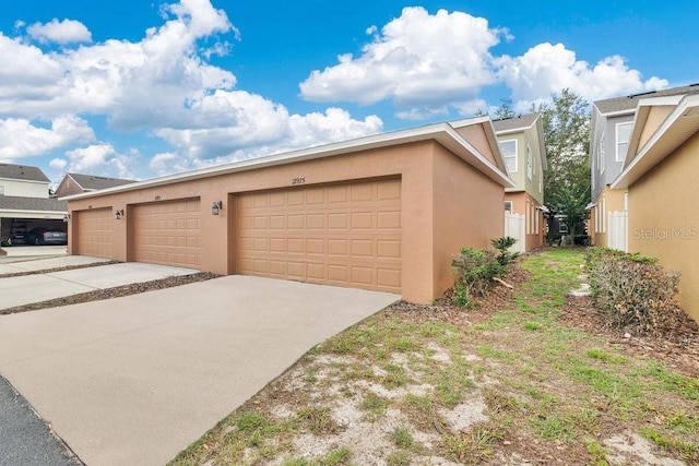 12975 Calderdale Ave, Windermere, FL 34786 - garage with concrete driveway