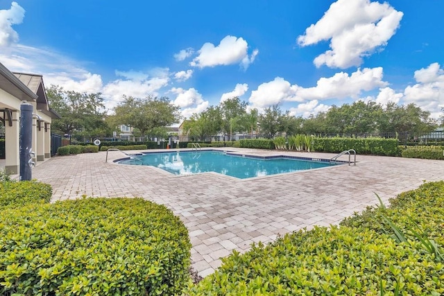 12975 Calderdale Ave, Windermere, FL 34786 - community pool with a patio