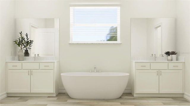 6830 E 115th St, Palmetto, FL 34221 - full bath featuring wood finished floors, a freestanding bath, and two vanities