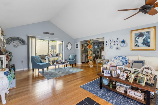 12234 Cider Mill Ln, Hudson, FL 34667 - living room with a ceiling fan, vaulted ceiling, and wood finished floors