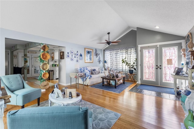 12234 Cider Mill Ln, Hudson, FL 34667 - living room with ceiling fan, vaulted ceiling, french doors, and wood finished floors