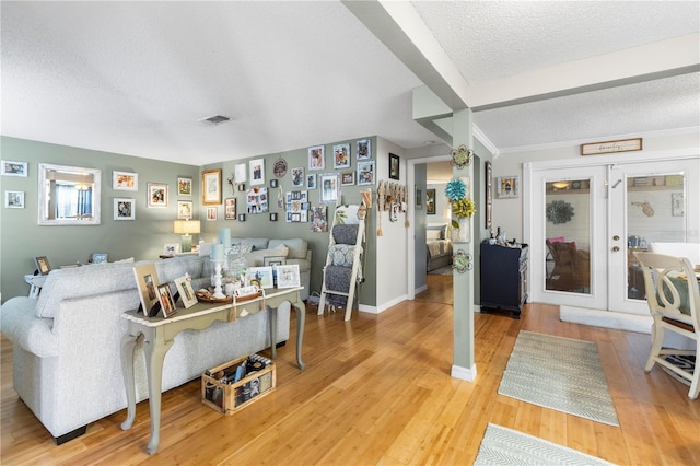 12234 Cider Mill Ln, Hudson, FL 34667 - living room with a textured ceiling and light wood-type flooring